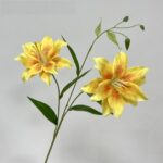 Two yellow silk lilies, elegant artificial flower bouquet perfect for wedding decorations.