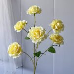Bunch of bright yellow silk roses, ideal as faux wedding flowers decor
