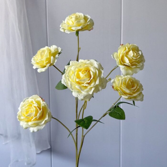 Bunch of bright yellow silk roses, ideal as faux wedding flowers decor