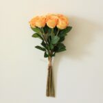 Bouquet of orange silk roses, perfect faux wedding flowers for decor.