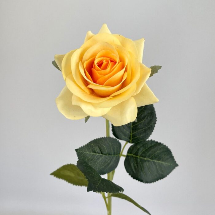 Realistic yellow artificial flower rose, ideal for faux wedding decor and arrangements.
