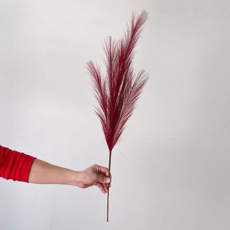 Red plastic reed artificial flower used for wedding decor and floral arrangements.