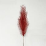 Red feathery plume perfect for decorating wreaths, boutonnieres, or creating faux wedding flowers.