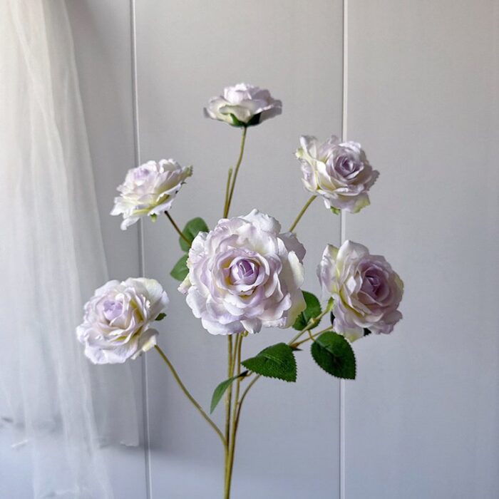 Six heads of realistic faux silk roses for decorative wedding arrangements.