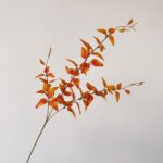 Artificial autumn leaf arrangement, a realistic faux wedding flower centerpiece for decoration.