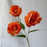 Three realistic 3D silk poppy flowers, ideal faux wedding flowers for decoration.
