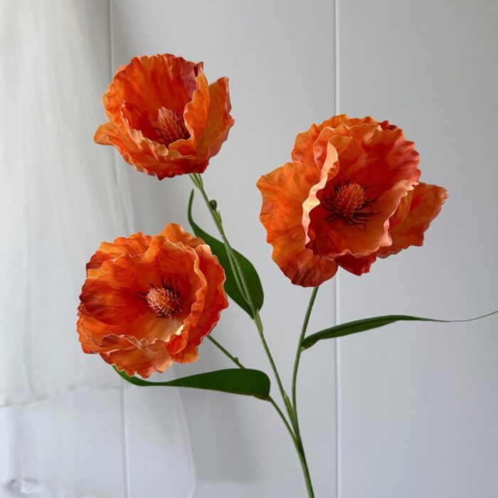 Three realistic 3D silk poppy flowers, ideal faux wedding flowers for decoration.