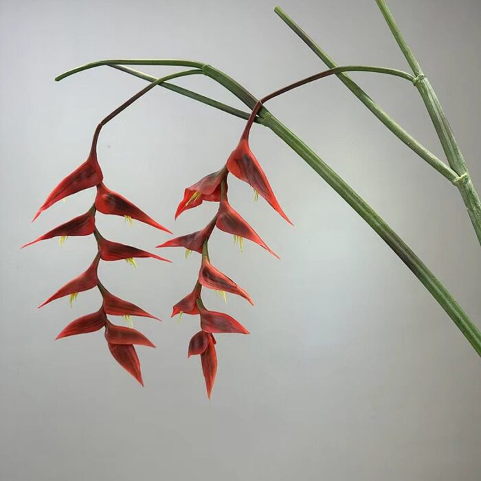 Two red real touch hanging bird of paradise stems